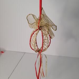 Festive Ornament with Gold Ribbon and Tassels